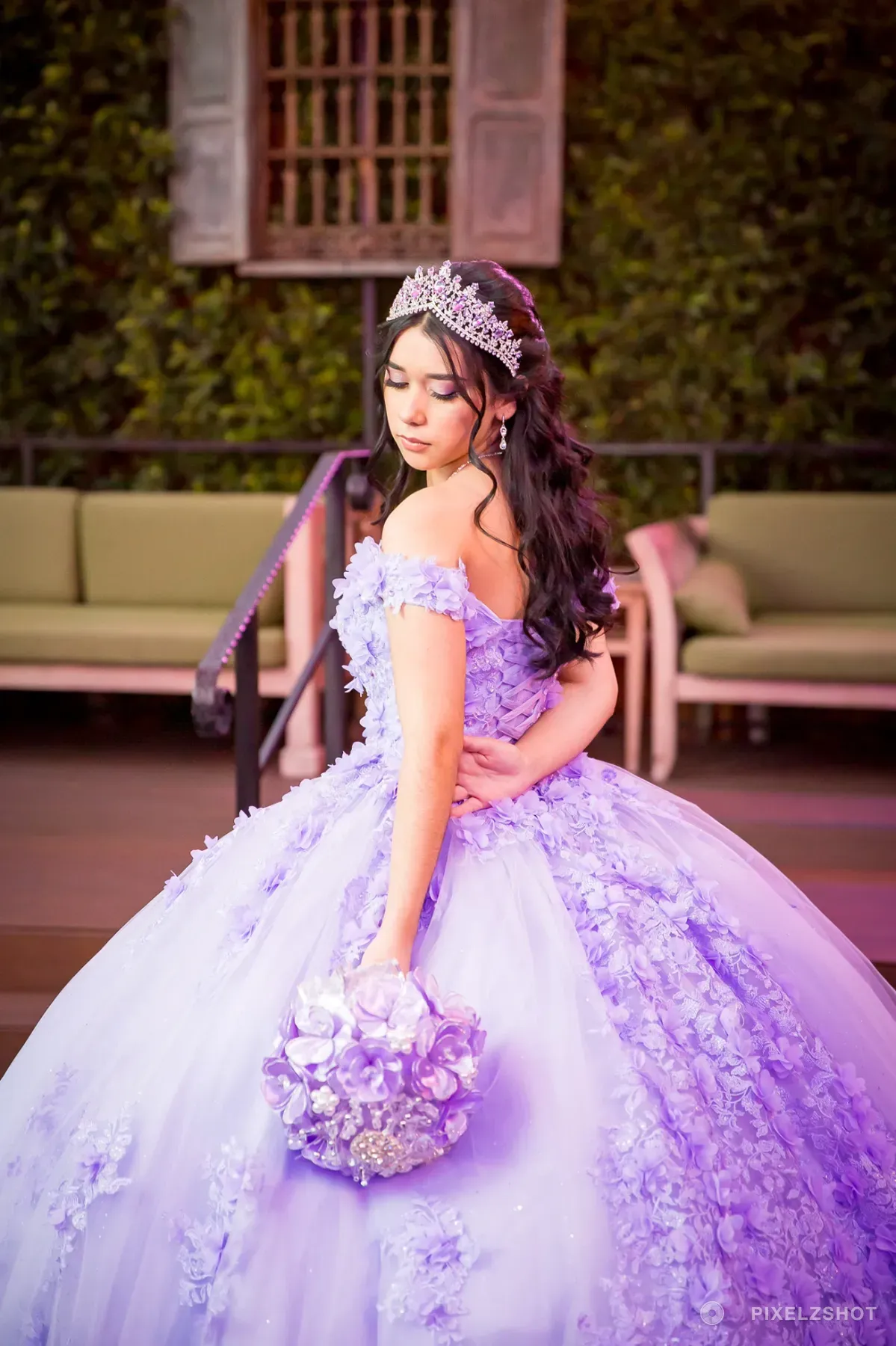 Jasmine turned away from the camera, showing the three-dimensional flowers running down the back of the gown