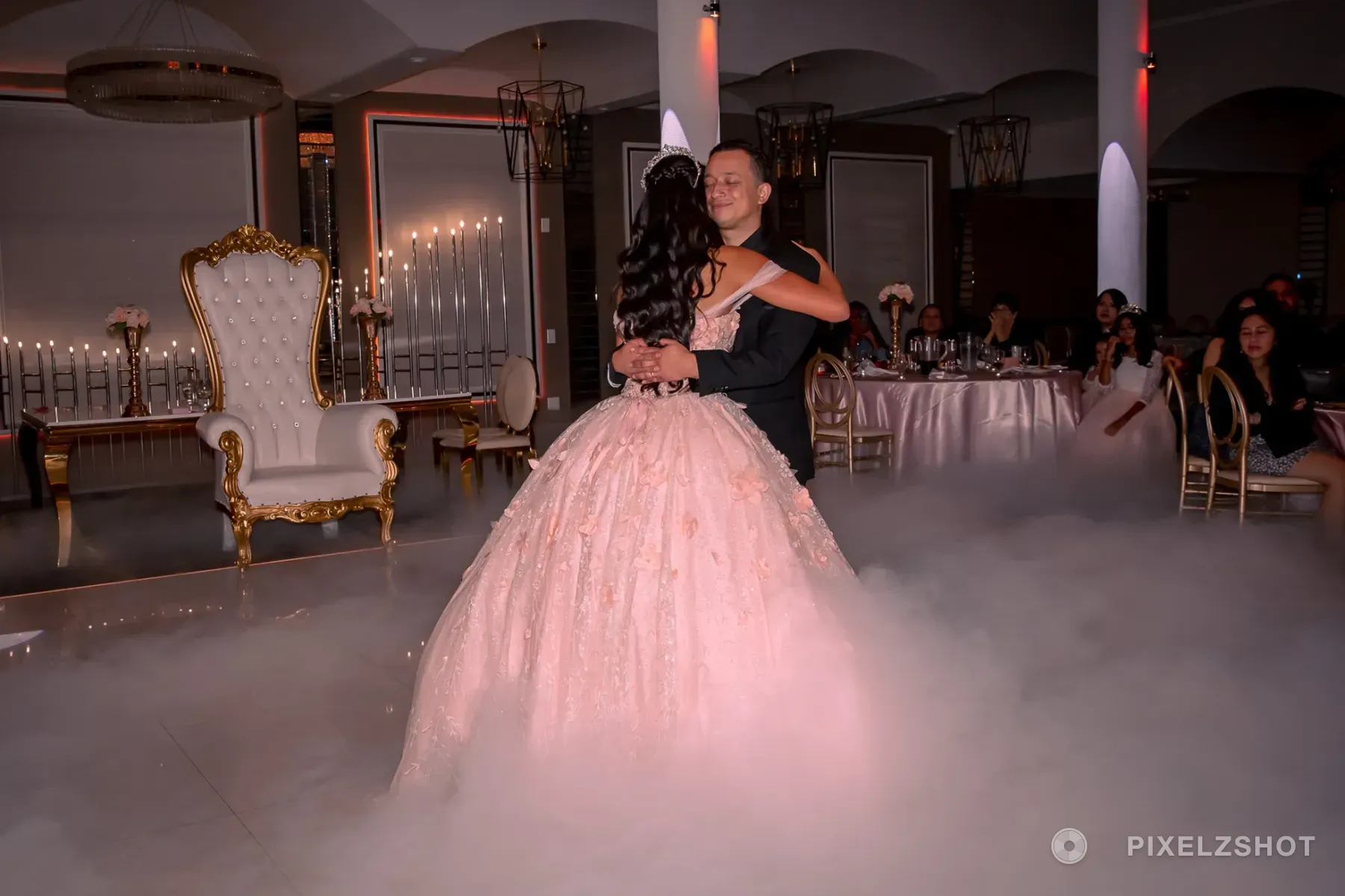 The same dance from the other side, her father's face over her shoulder and the guest tables watching behind
